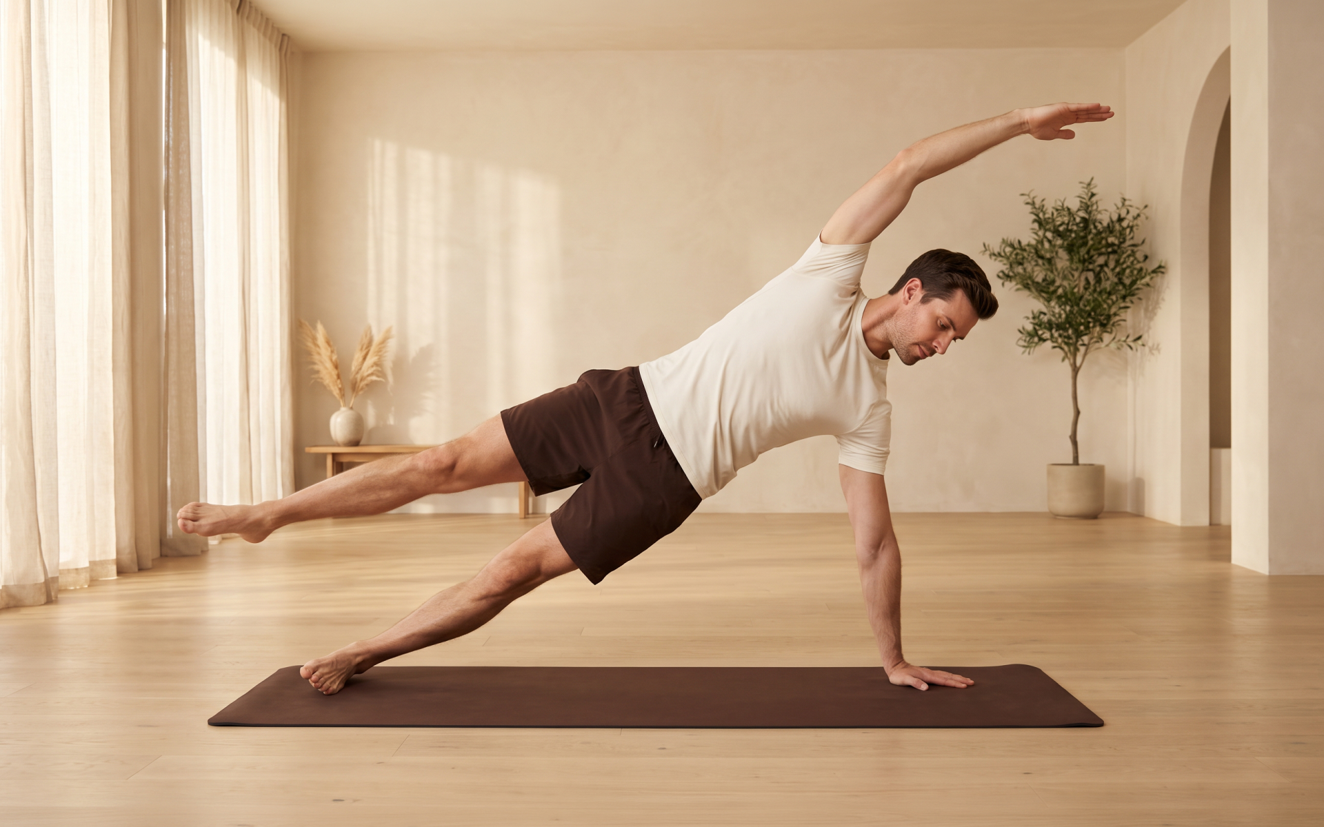 Man performing a side plank leg lift during a Pilates for men workout at home.
