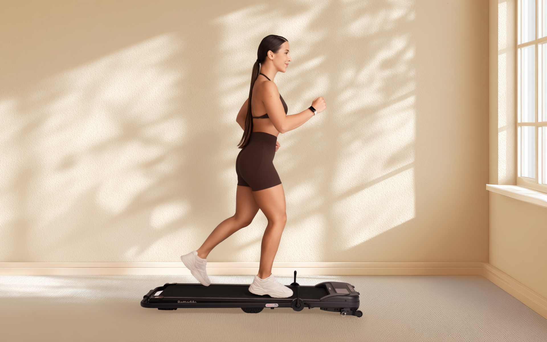Woman jogging on a treadmill at home for a running plan for beginners.