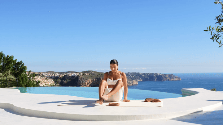 Lessie Fitness performing butterfly stretch