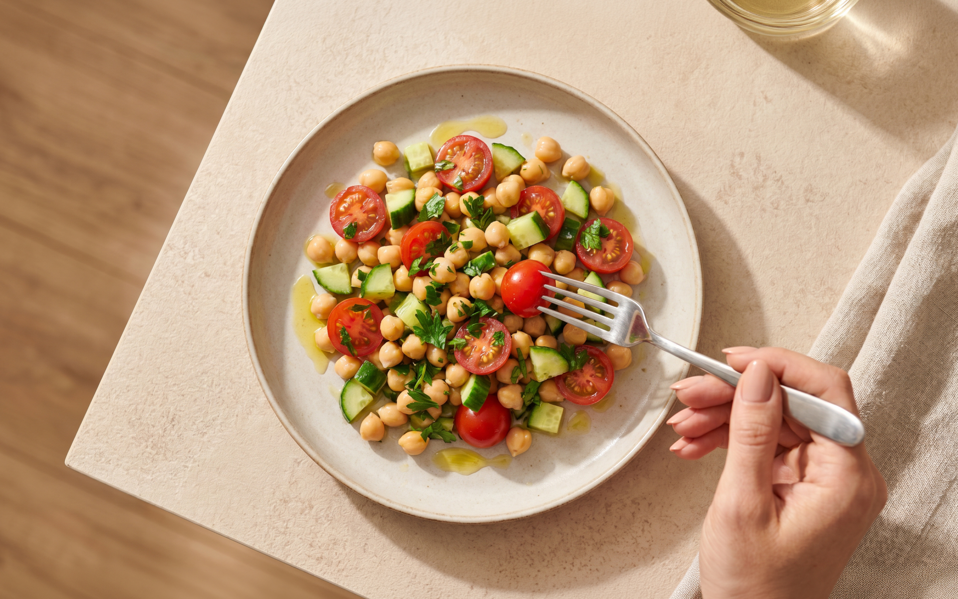 Mediterranean diet weekly meal plan featuring a chickpea salad with cucumber, tomatoes, fresh herbs, and olive oil.