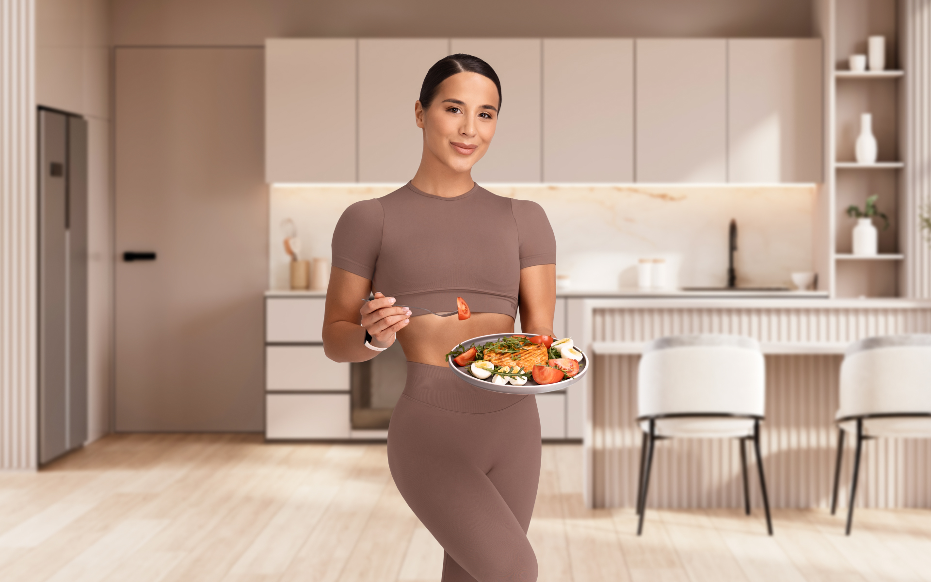 Woman holds a plate of salad with eggs and vegetables in a kitchen, representing a military weight loss diet meal.