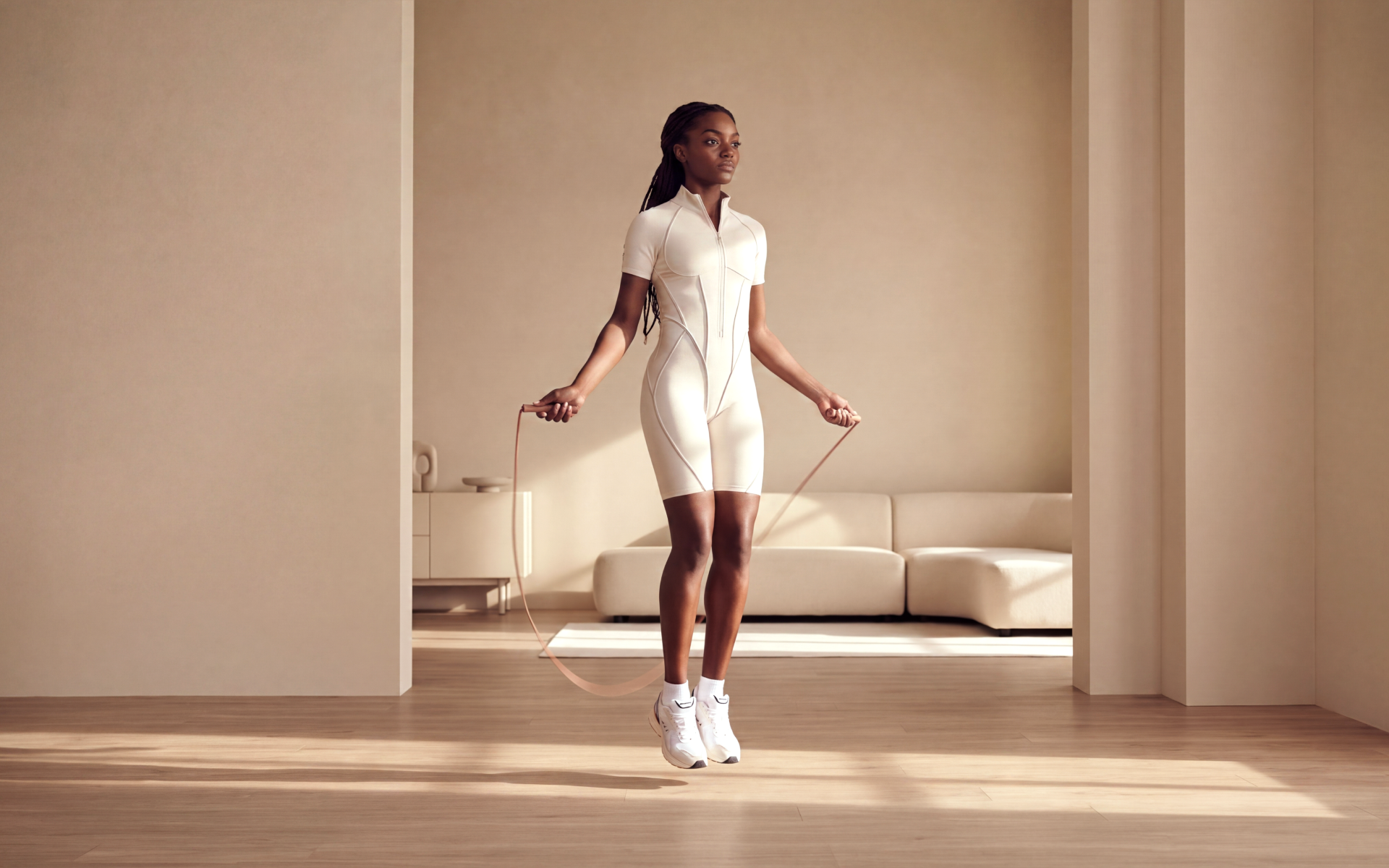 Woman jumping rope at home for a jump rope workout plan.