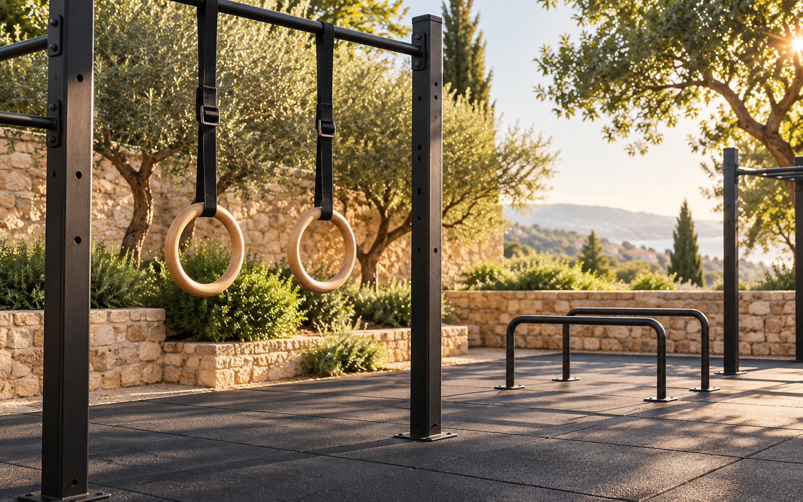 Gymnastic rings hanging from an outdoor bar for building a calisthenics physique.